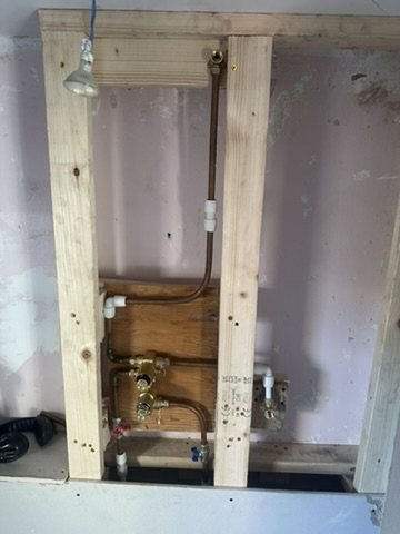 Concealed shower valve fixed between studs