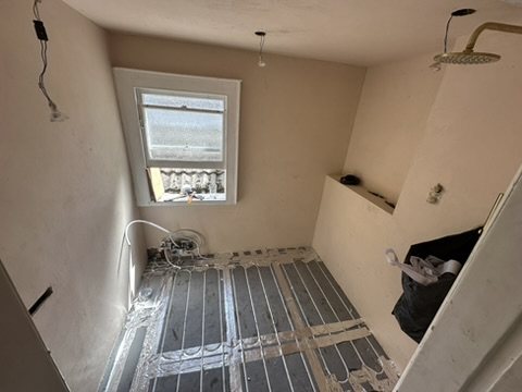 Underfloor heating laid across the floor