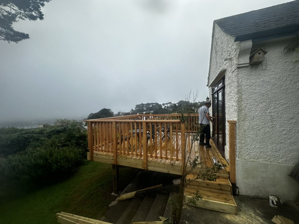 Finished deck seen from the garden with steps at the house end