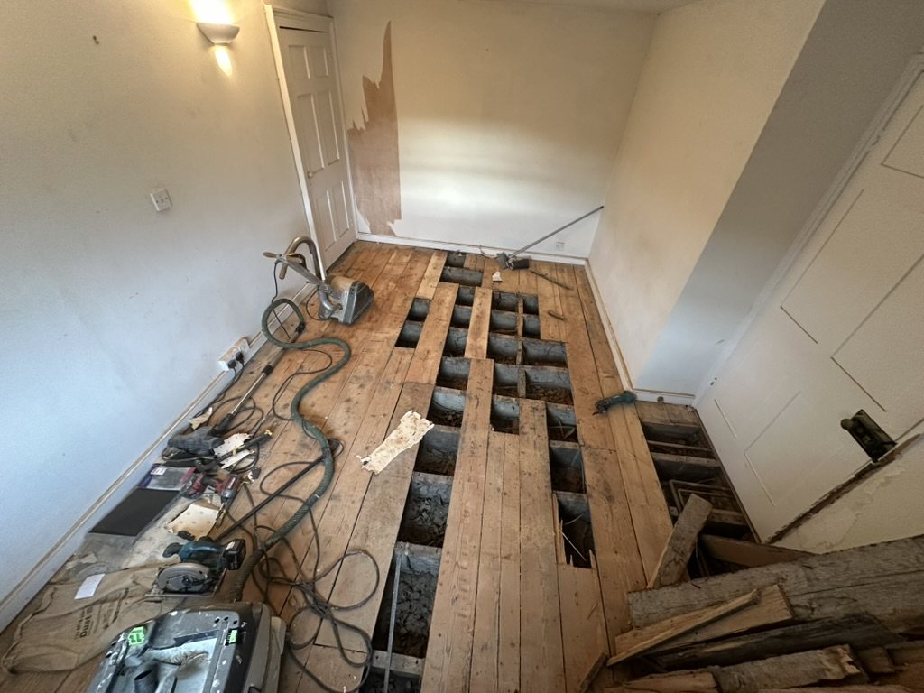 Original floorboards lifted for repair