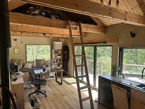 Living space with the ladder to the sleeping loft