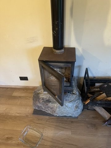 Wood burner on a stone hearth
